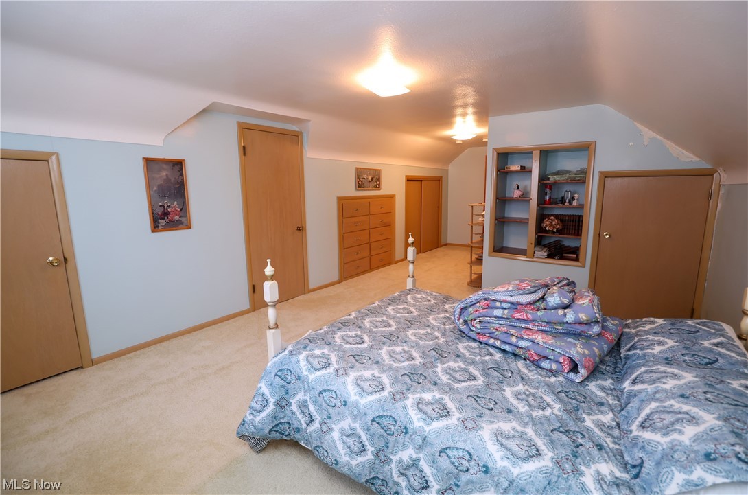 29252 Barjode Road Willowick, OH 44095 - Photo 17 of 21 Bedroom featuring lofted ceiling and light colored carpet