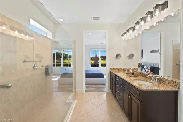 a view of walk in closet with clothes
