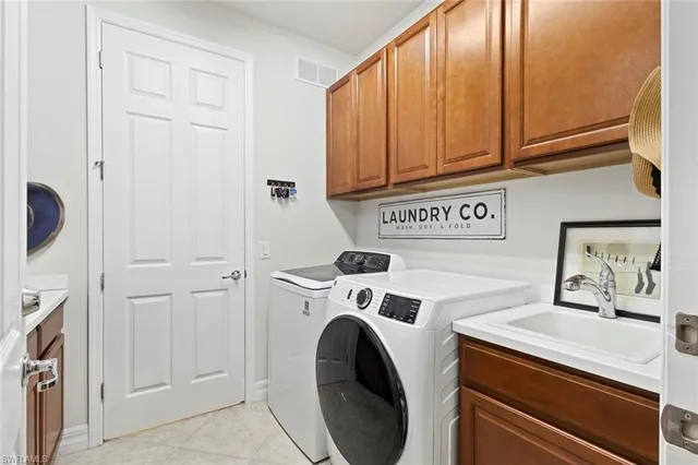 a bathroom with a granite countertop toilet a sink and a bathtub