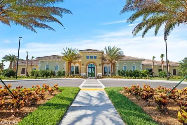 a living room with furniture and view of kitchen
