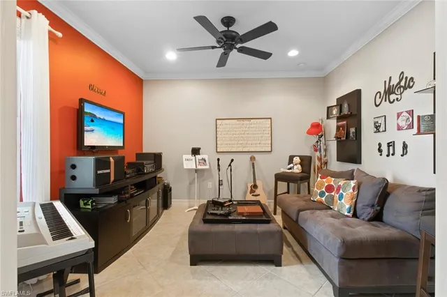 a dining room with furniture a chandelier and window