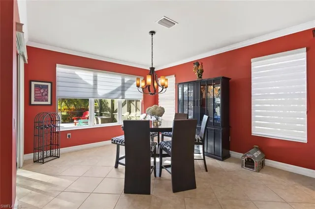 a living room with furniture and a flat screen tv with wooden floor