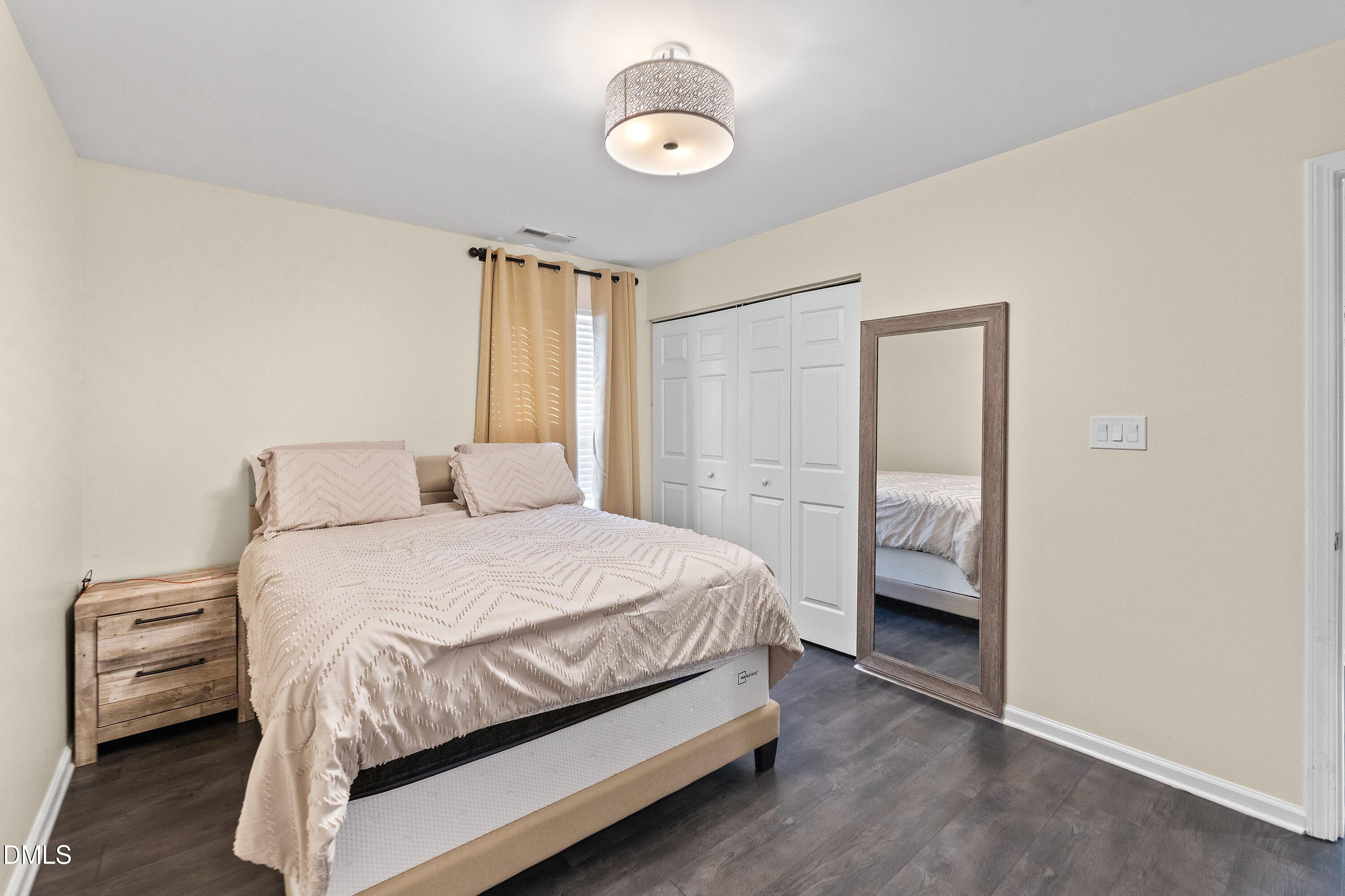 2027 Buffalo Way Durham, NC 27704 - Photo 21 of 30 a bedroom with a bed and a window