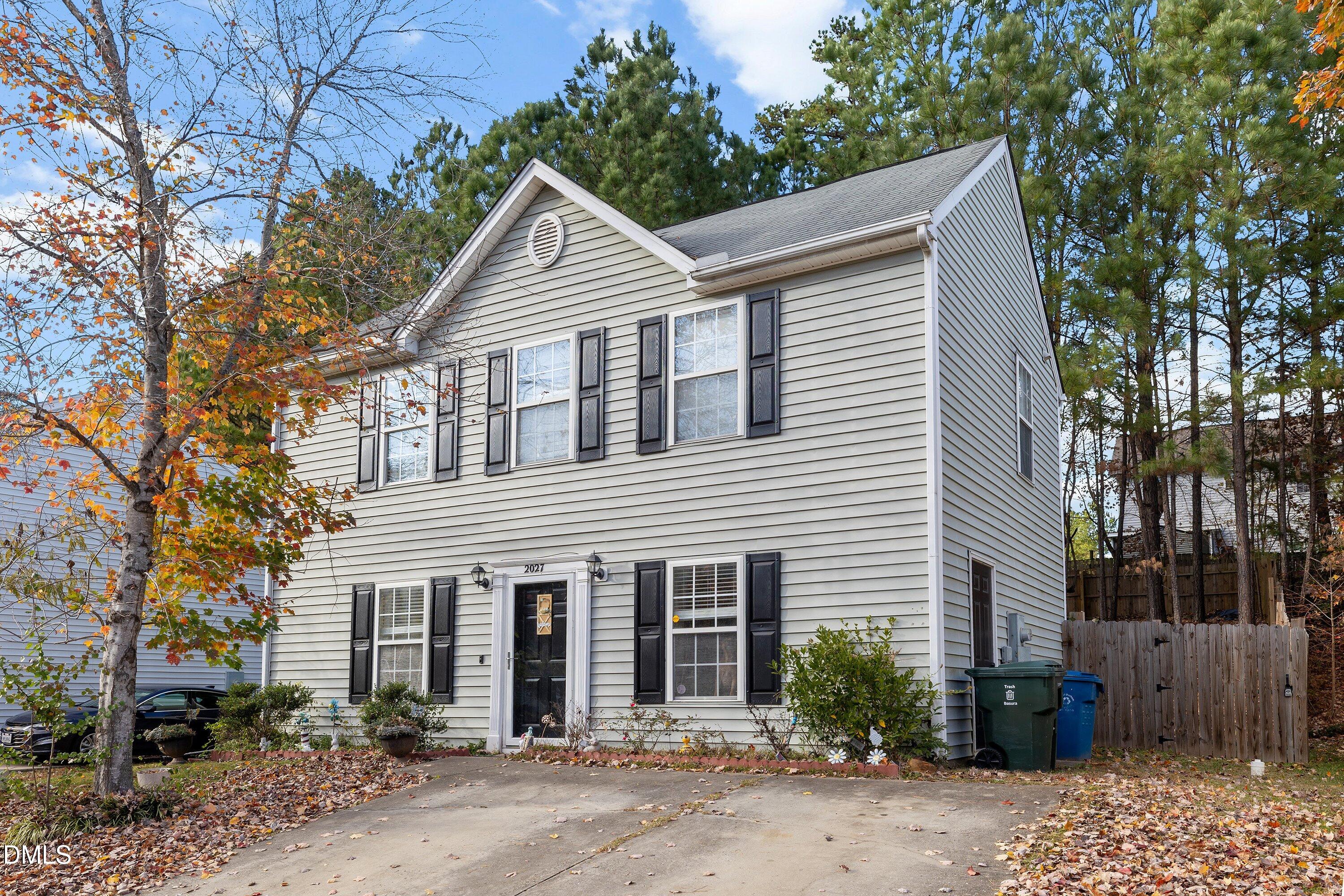 2027 Buffalo Way Durham, NC 27704 - Photo 3 of 30 a view of a white house next to a road and yard