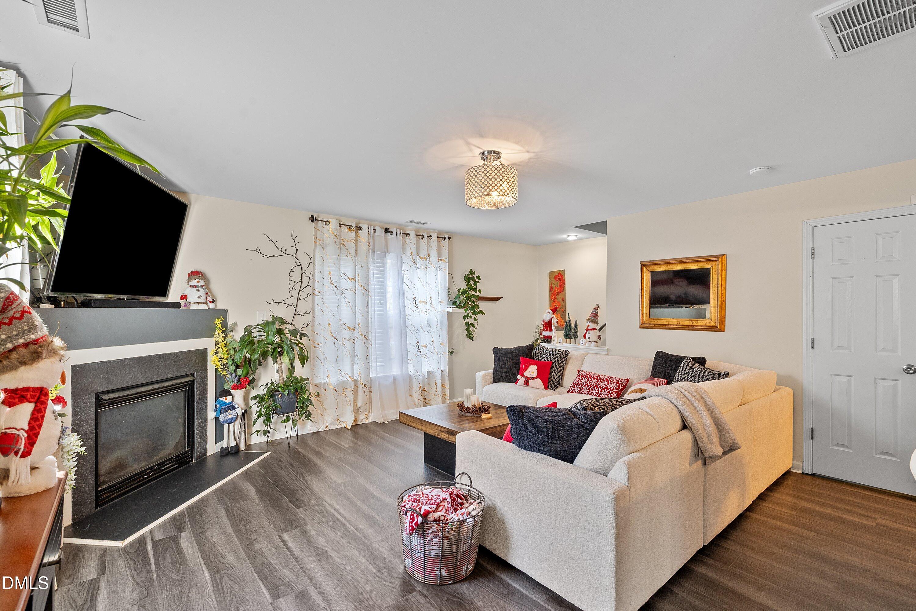 2027 Buffalo Way Durham, NC 27704 - Photo 5 of 30 a living room with furniture and a flat screen tv