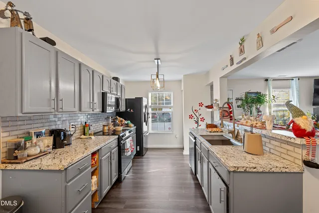 a kitchen that has a lot of cabinets in it