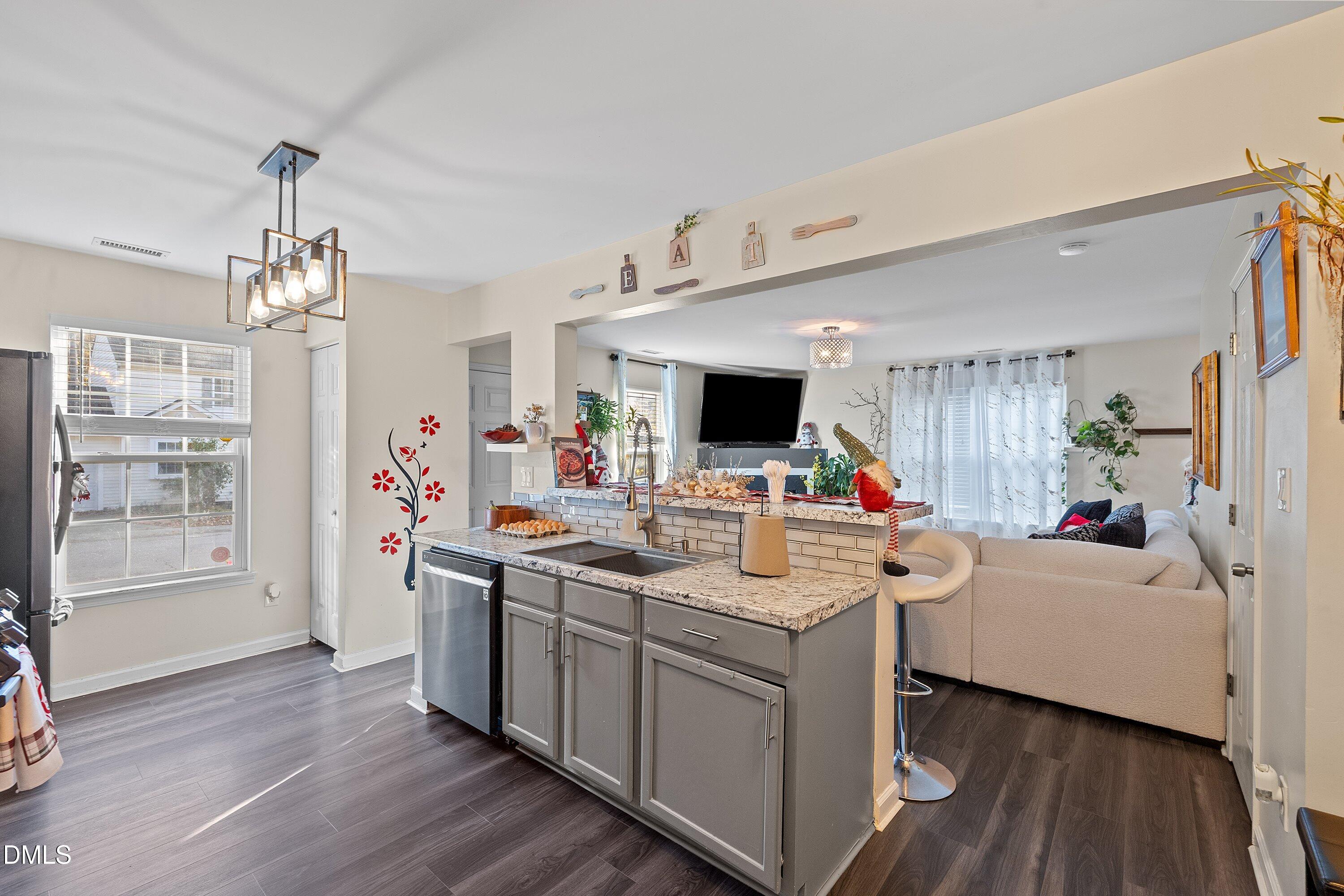 2027 Buffalo Way Durham, NC 27704 - Photo 10 of 30 a view of living room with furniture and flat screen tv