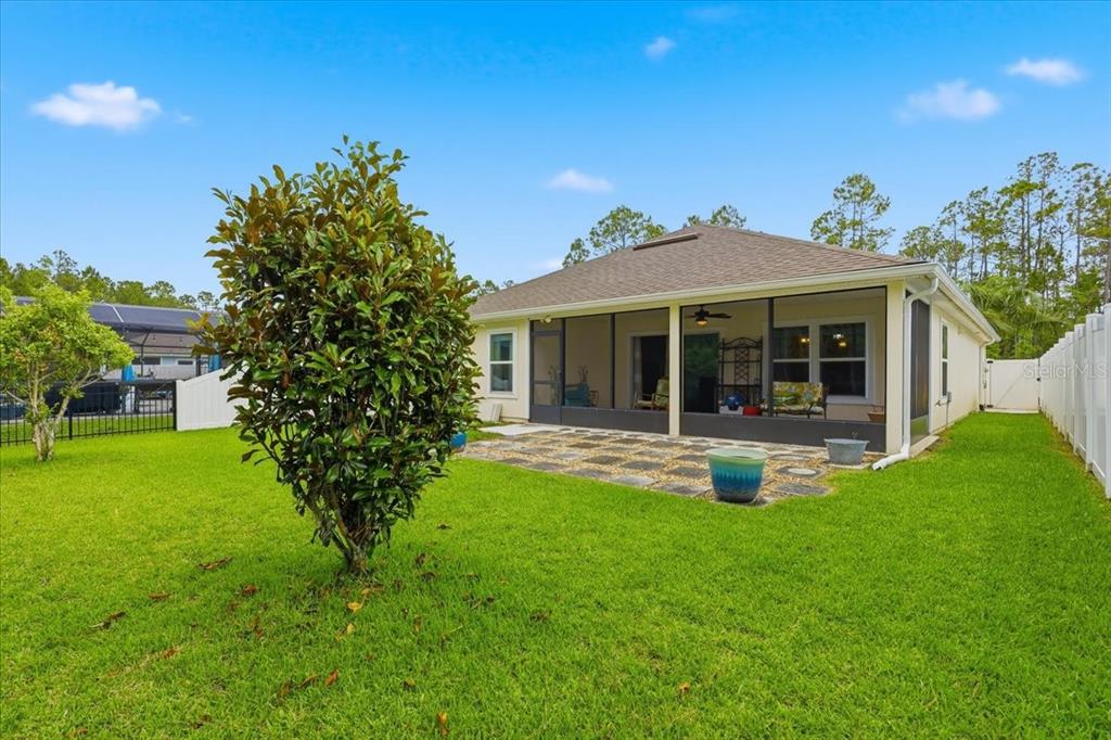 35 Birdie Way Bunnell, FL 32110 - Photo 41 of 57 a view of a house with a yard