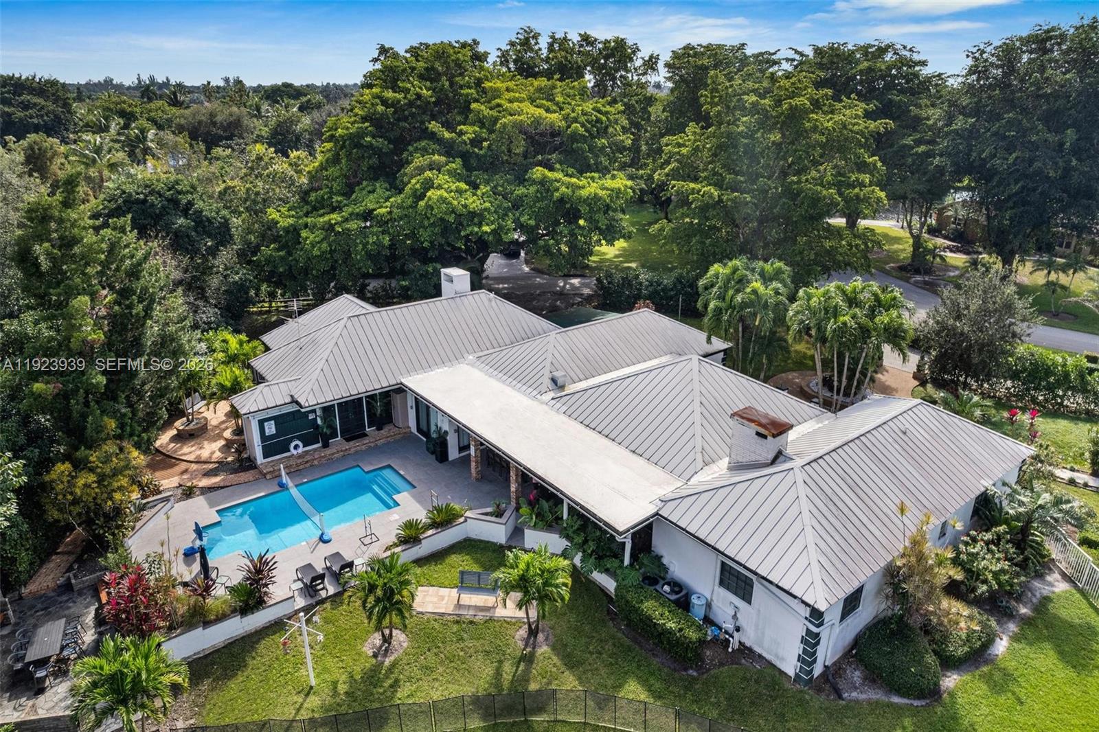 11155 Southwest 40th Street Davie, FL 33328 - Photo 1 of 100 an aerial view of a house with swimming pool and outdoor seating
