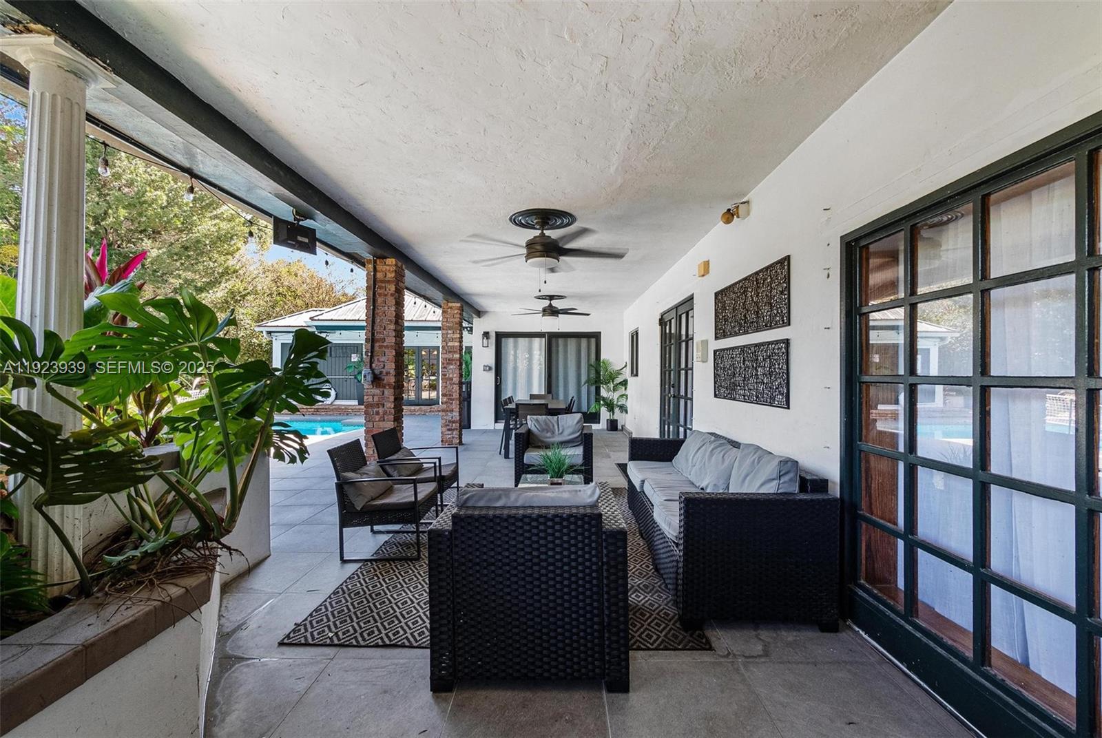 11155 Southwest 40th Street Davie, FL 33328 - Photo 11 of 74 a living room with furniture and a large window