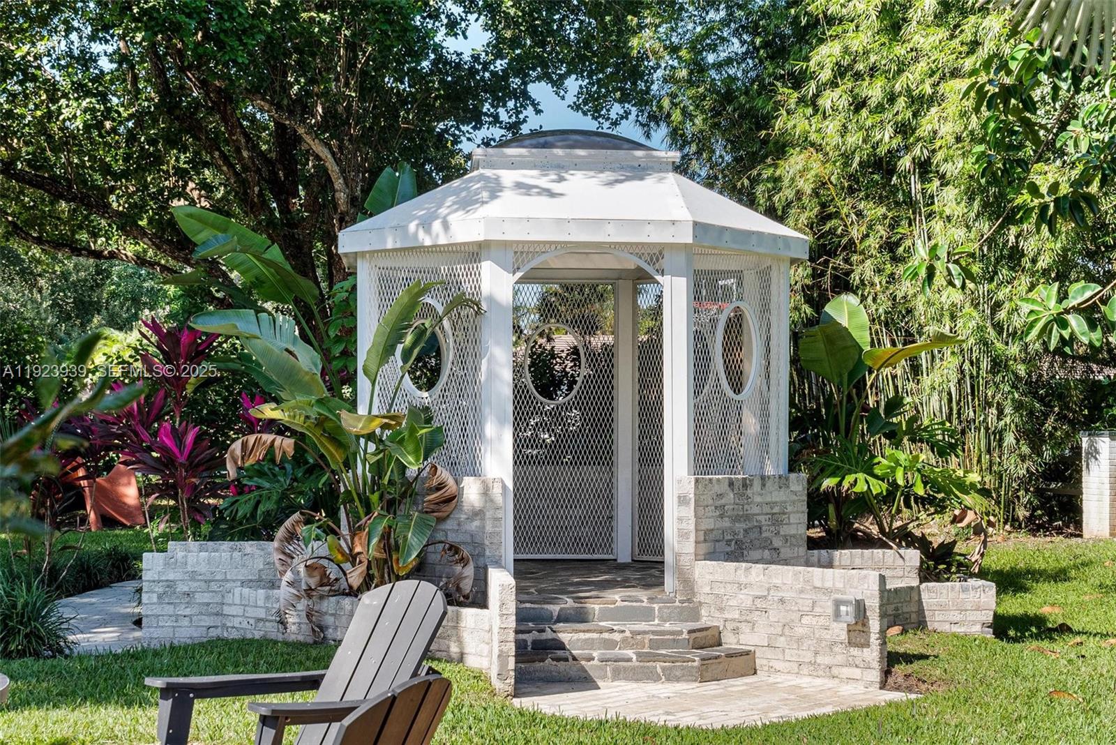 11155 Southwest 40th Street Davie, FL 33328 - Photo 14 of 74 a front view of a house with yard