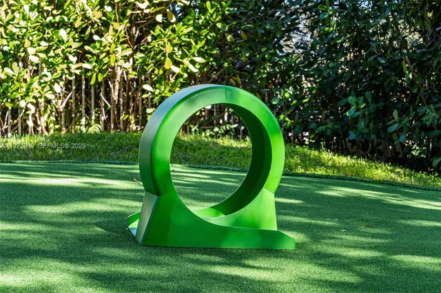 a view of a house with swimming pool and sitting area