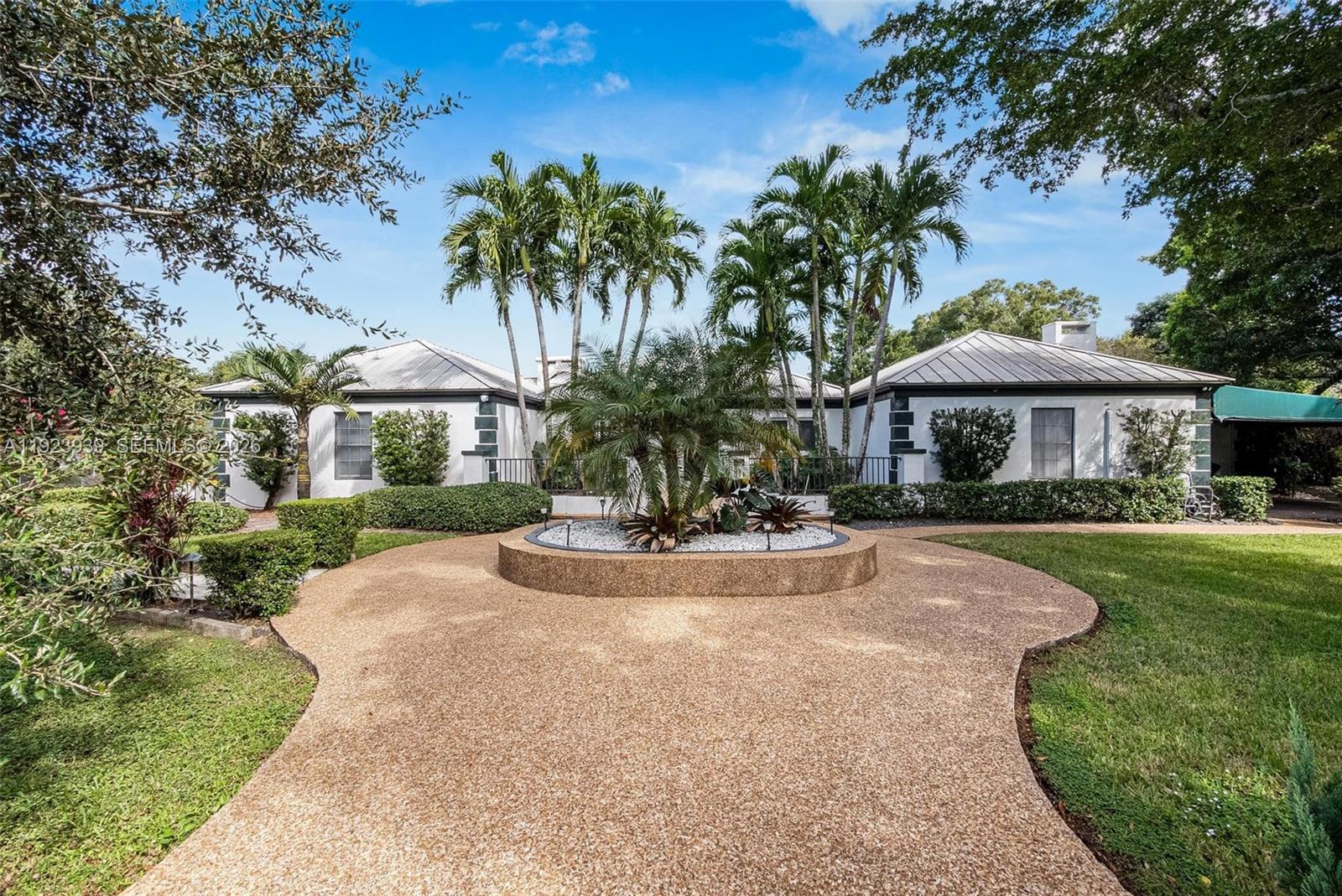 11155 Southwest 40th Street Davie, FL 33328 - Photo 2 of 100 a view of a house with swimming pool and sitting area