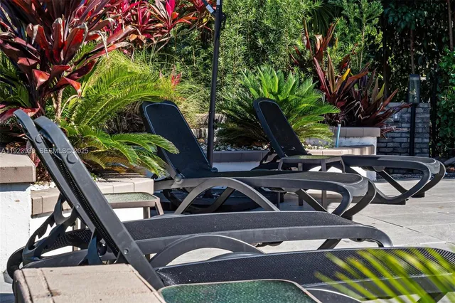 a front view of a house with a yard table and chairs