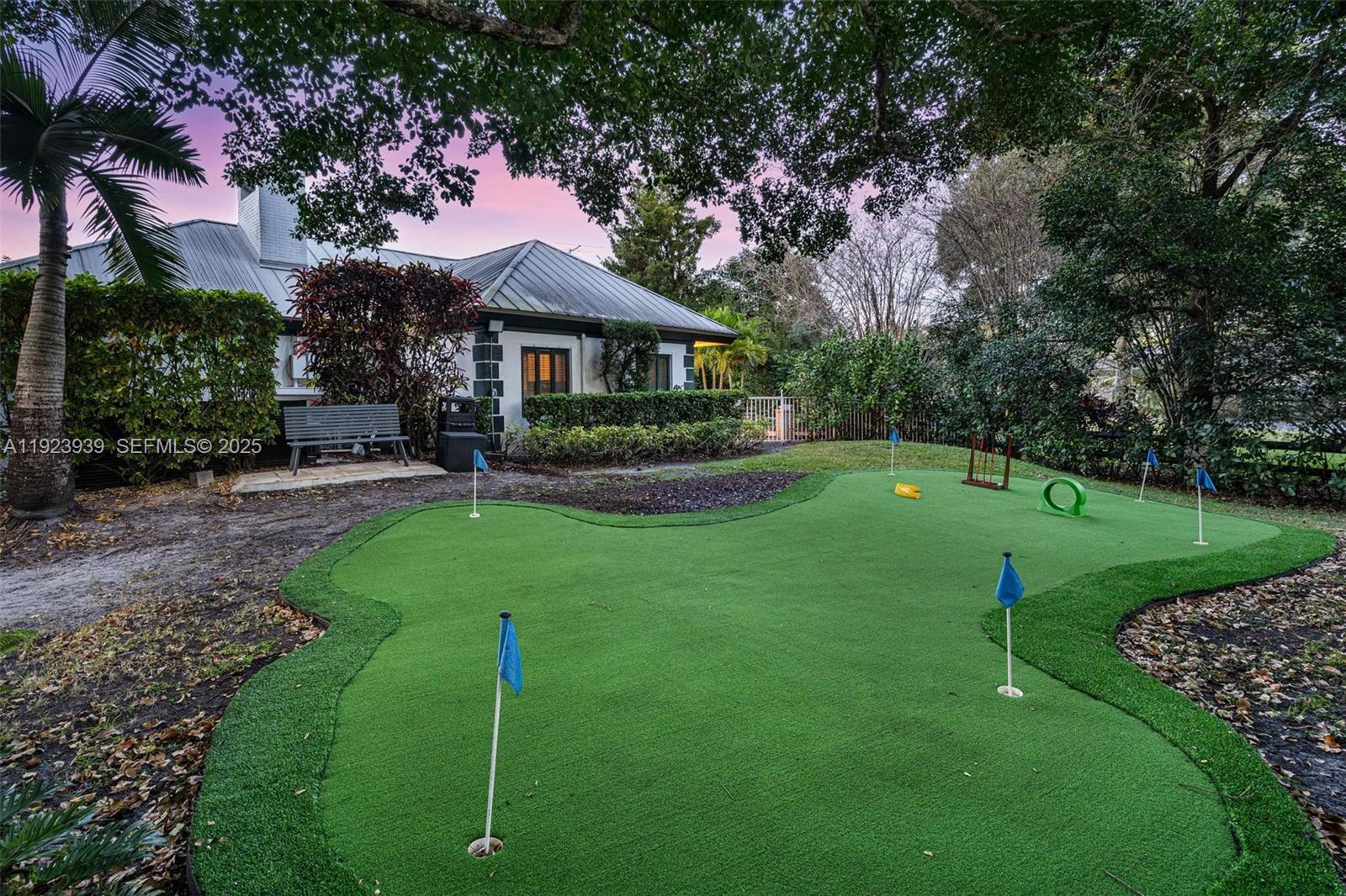 11155 Southwest 40th Street Davie, FL 33328 - Photo 35 of 74 a front view of a house with a yard table and chairs