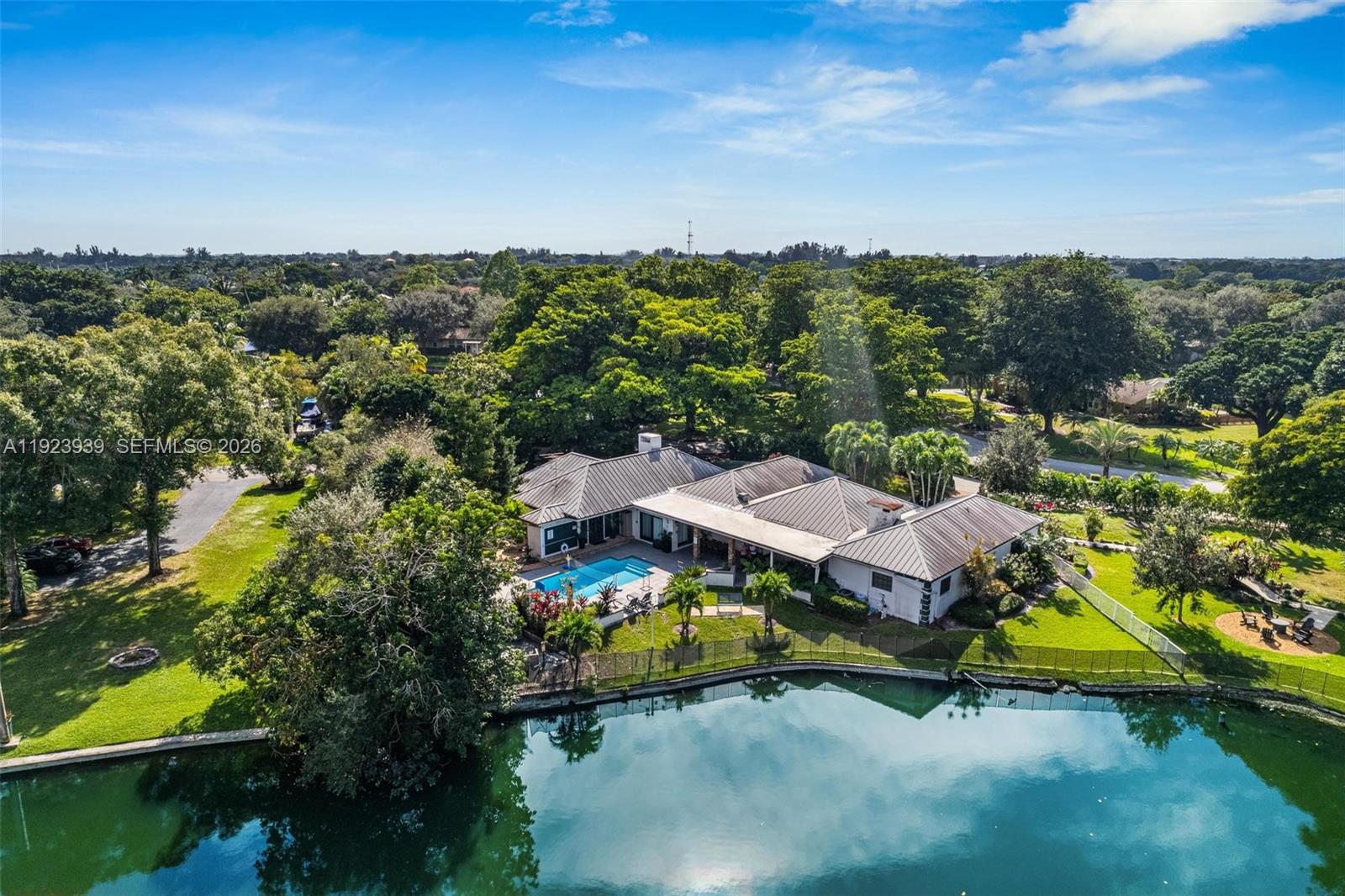 11155 Southwest 40th Street Davie, FL 33328 - Photo 35 of 100 an aerial view of a house with a garden and lake view