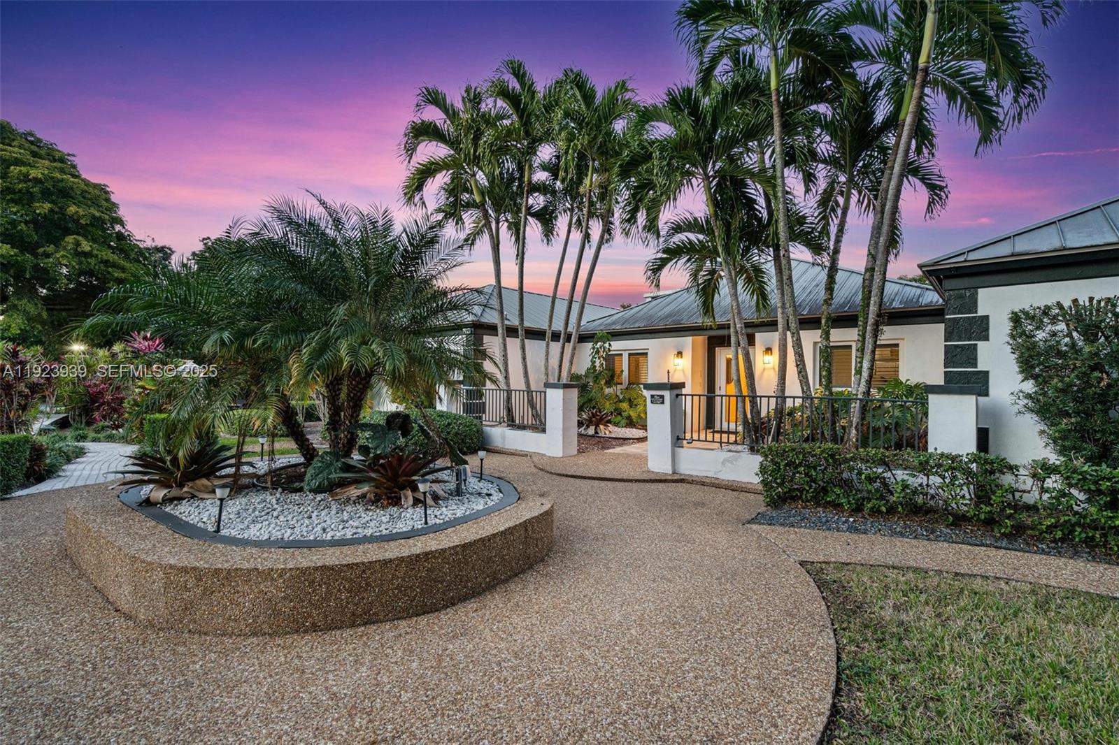 11155 Southwest 40th Street Davie, FL 33328 - Photo 36 of 74 a view of a house with a swimming pool and a sitting area