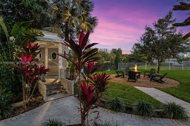 an aerial view of house with yard swimming pool and outdoor seating