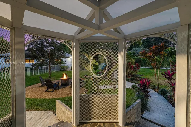 an aerial view of a house with pool outdoor seating yard and mountain view