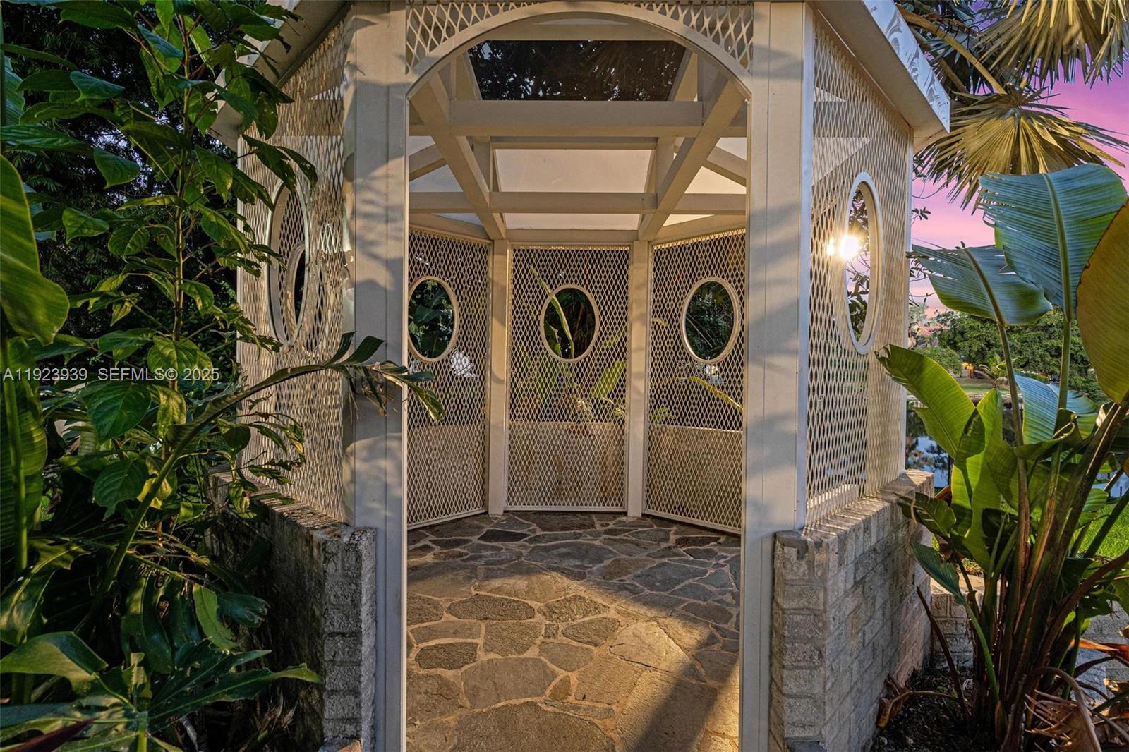 11155 Southwest 40th Street Davie, FL 33328 - Photo 46 of 74 a front view of a house with a tree