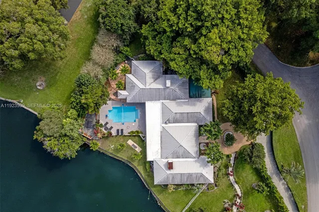 a view of a patio with a table chairs and a backyard