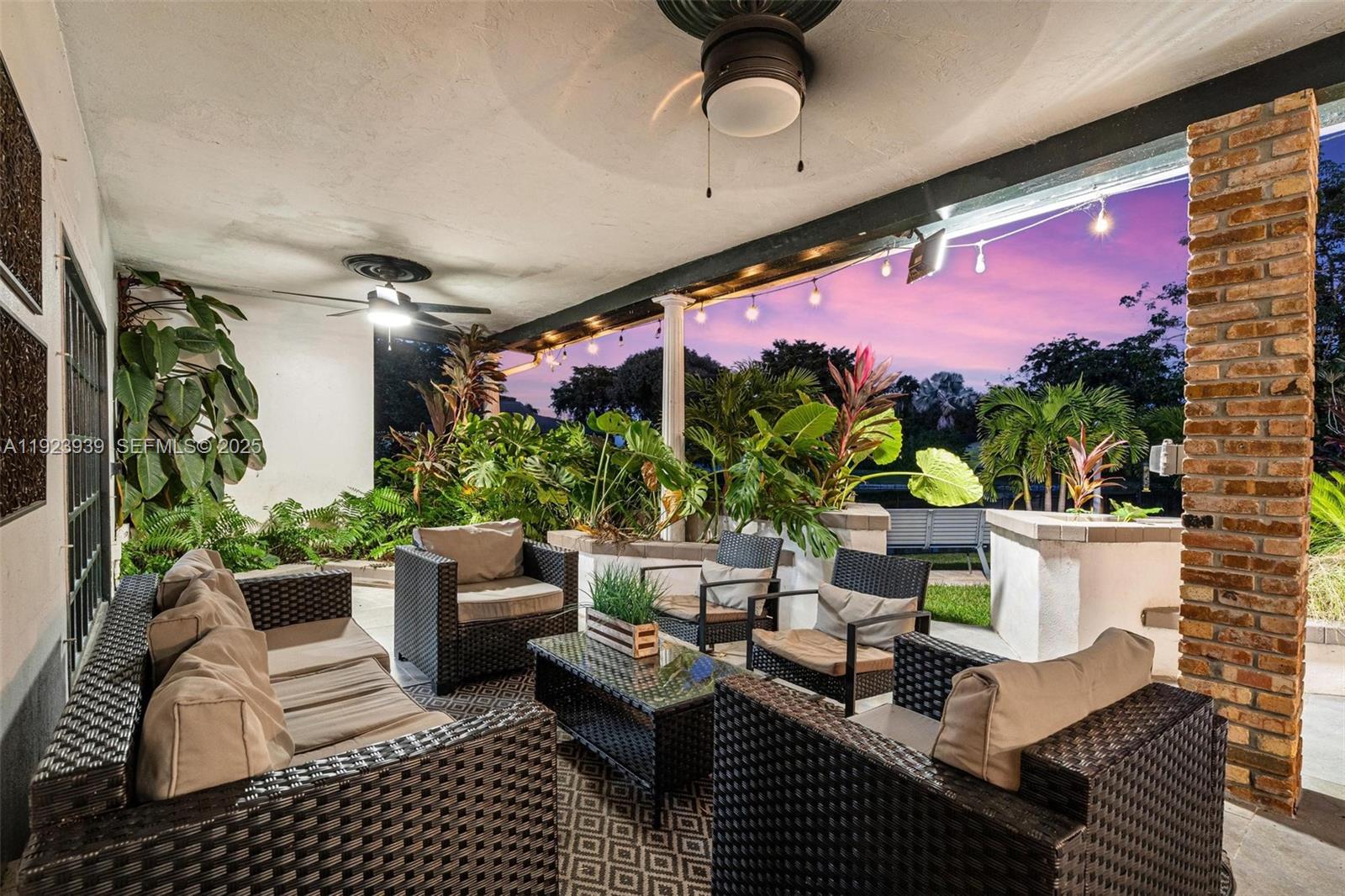 11155 Southwest 40th Street Davie, FL 33328 - Photo 59 of 74 a view of a patio with couches and potted plants