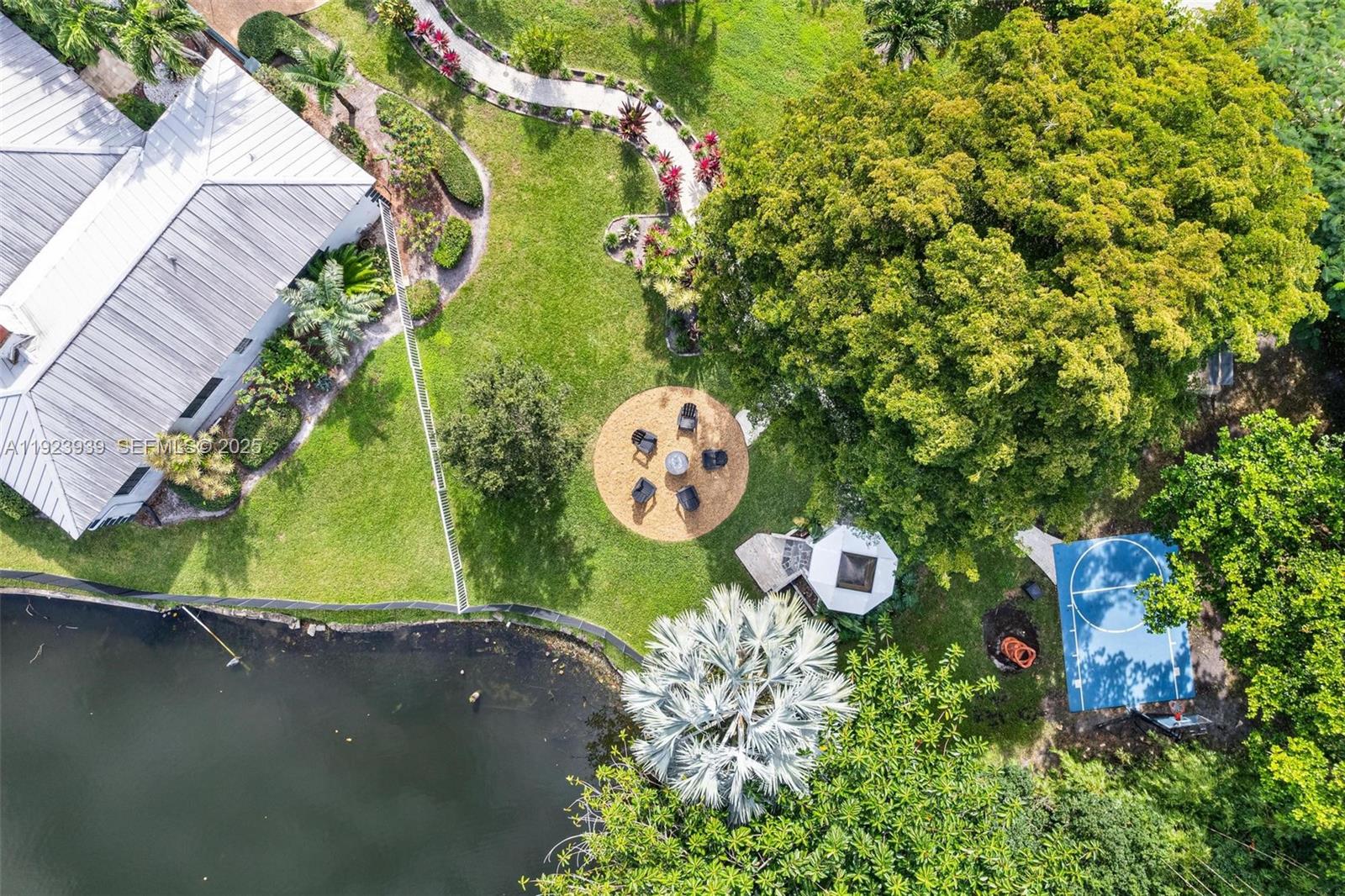 11155 Southwest 40th Street Davie, FL 33328 - Photo 6 of 74 an aerial view of a house with a yard and swimming pool
