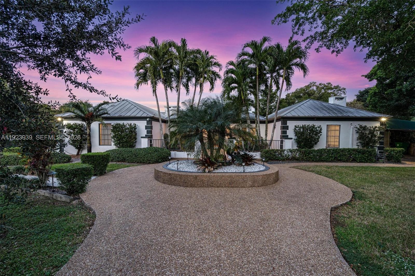 11155 Southwest 40th Street Davie, FL 33328 - Photo 63 of 100 a front view of a house with garden