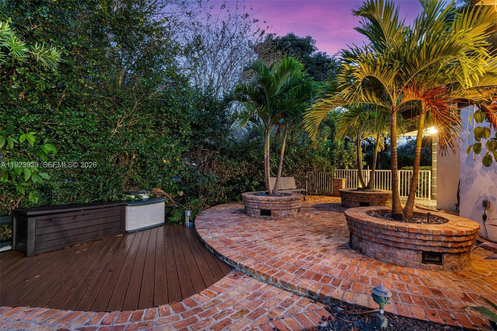 11155 Southwest 40th Street Davie, FL 33328 - Photo 76 of 100 a backyard of a house with table and chairs