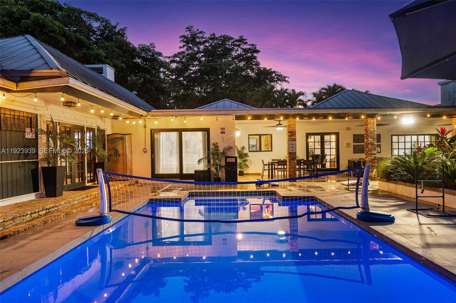 11155 Southwest 40th Street Davie, FL 33328 - Photo 78 of 100 a view of a patio with swimming pool and porch