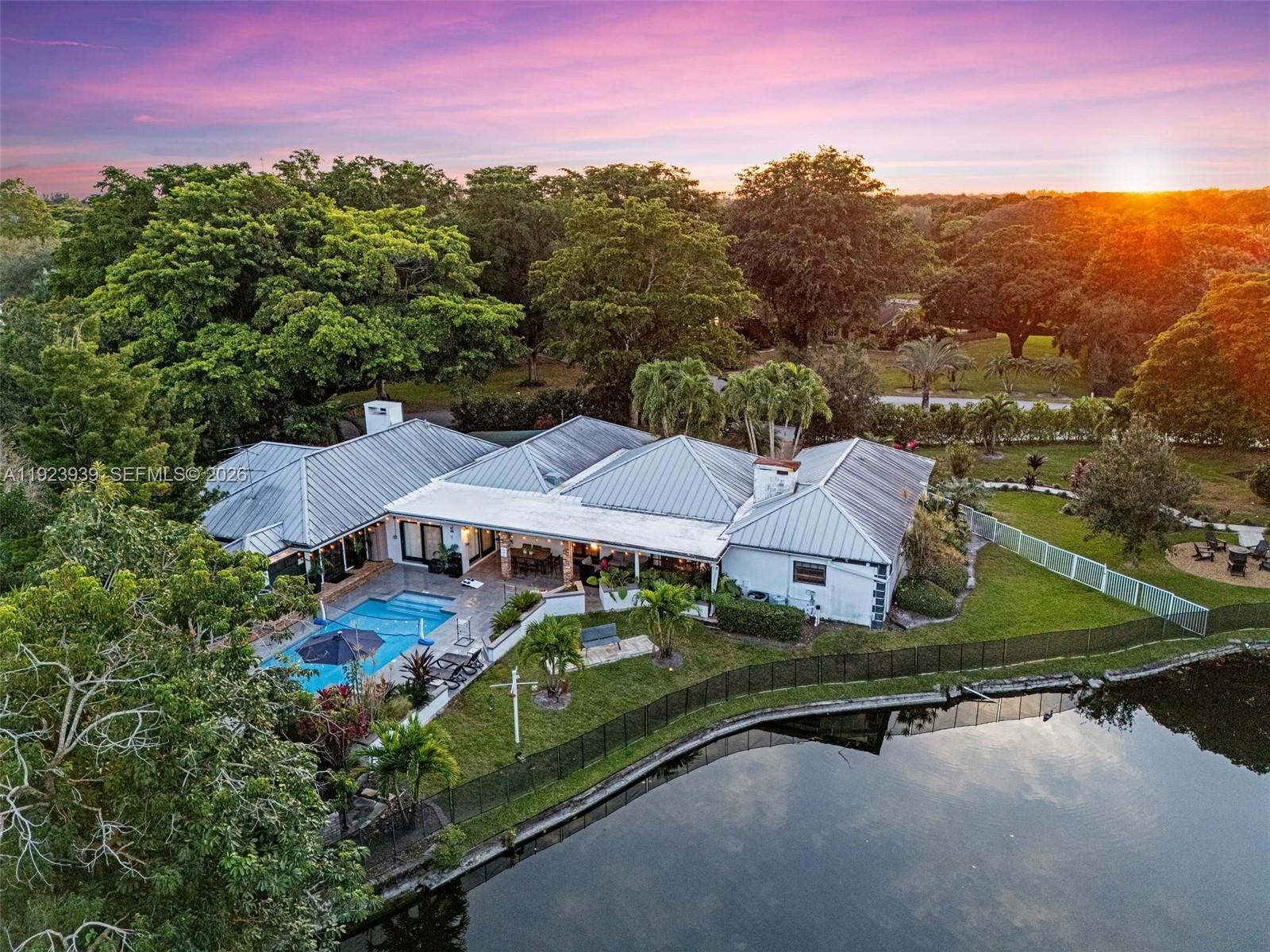11155 Southwest 40th Street Davie, FL 33328 - Photo 90 of 100 an aerial view of house with yard swimming pool and outdoor seating