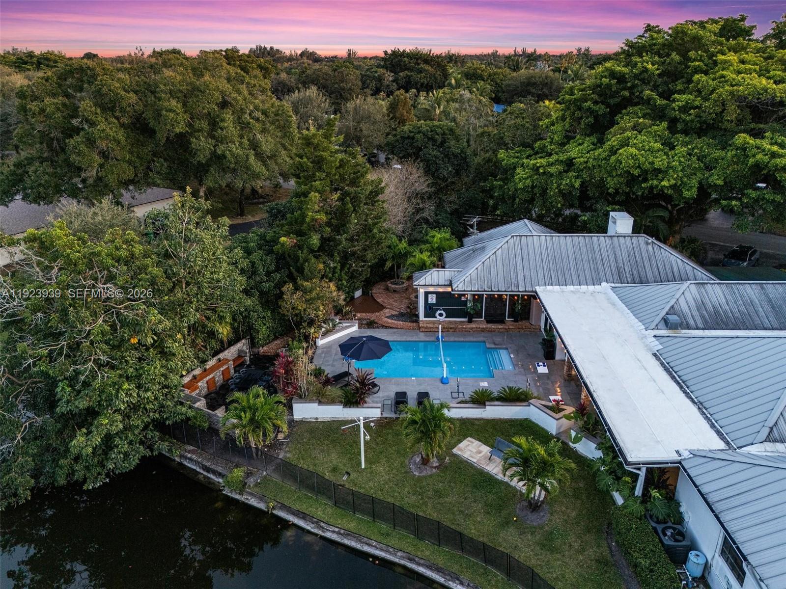 11155 Southwest 40th Street Davie, FL 33328 - Photo 95 of 100 an aerial view of a house with pool outdoor seating yard and mountain view