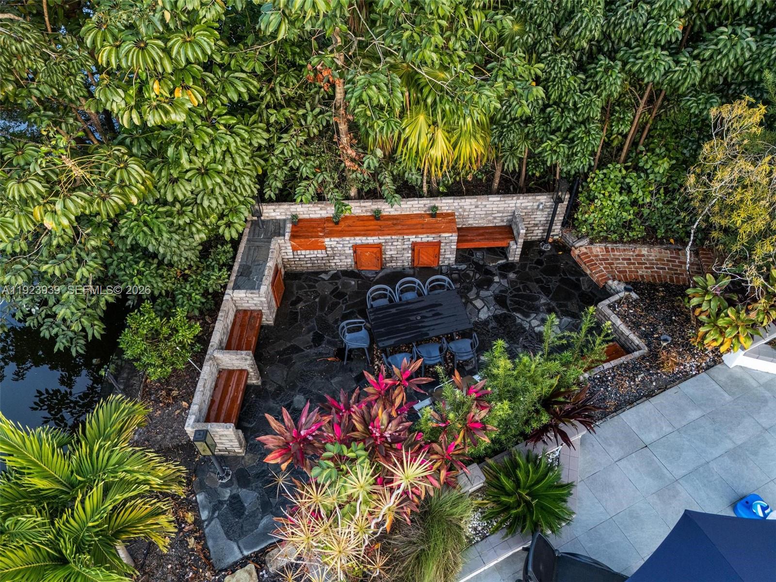 11155 Southwest 40th Street Davie, FL 33328 - Photo 99 of 100 an outdoor space with seating area and trees