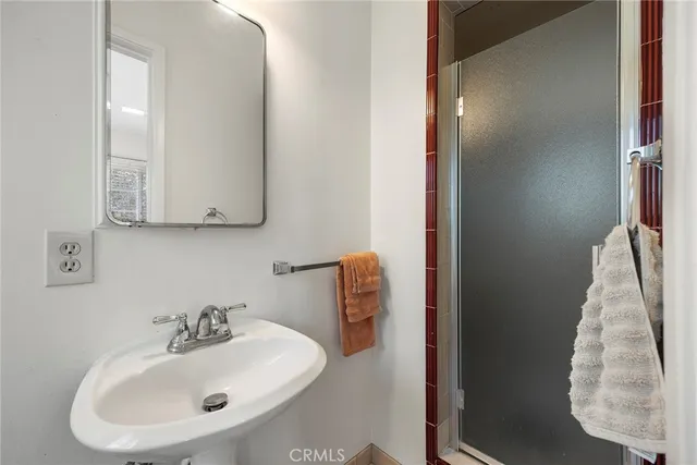 a bathroom with a sink and mirror
