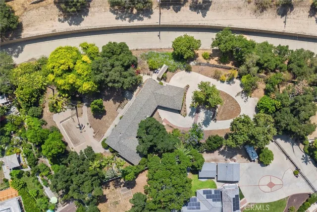 an aerial view of a house with a garden