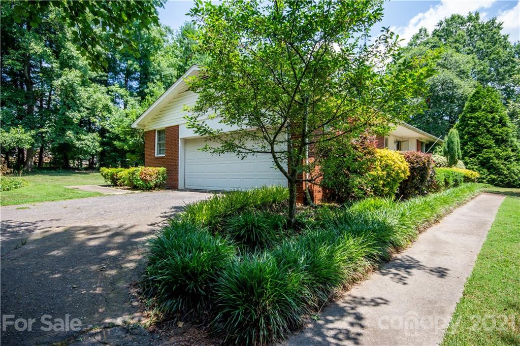 144 Buffaloway Road Statesville, NC 28677 - Photo 2 of 33 a front view of a house with a yard and trees