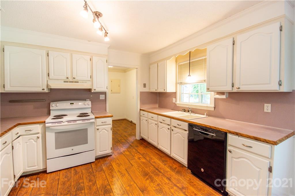 144 Buffaloway Road Statesville, NC 28677 - Photo 15 of 33 a kitchen with stainless steel appliances granite countertop a stove a sink and a microwave
