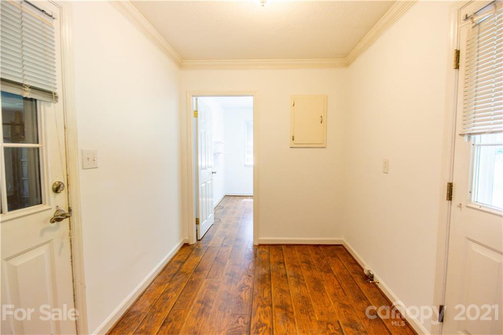 144 Buffaloway Road Statesville, NC 28677 - Photo 17 of 33 a view of a room with wooden floor and a hallway