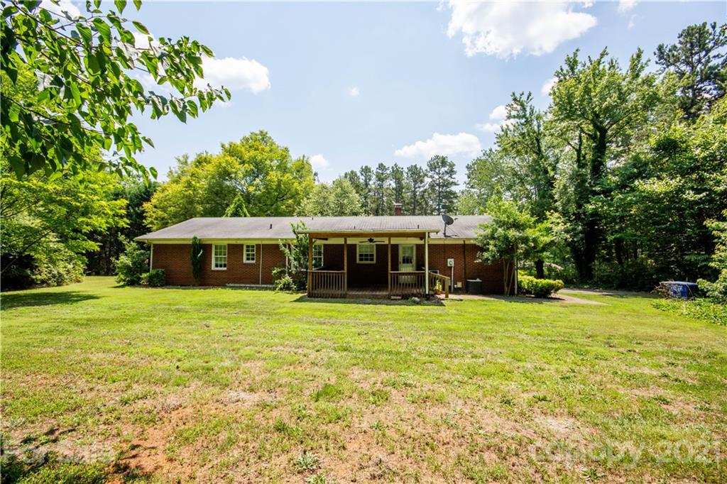 144 Buffaloway Road Statesville, NC 28677 - Photo 6 of 33 a view of a big house with a garden