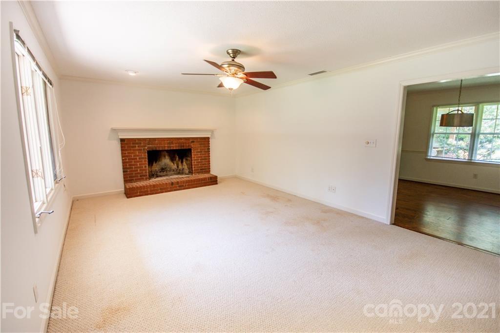 144 Buffaloway Road Statesville, NC 28677 - Photo 8 of 33 an empty room with windows and fireplace