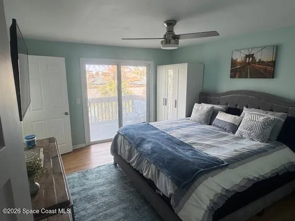 a bedroom with a bed and a walk in closet