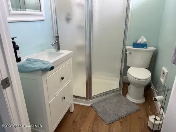 a bedroom with furniture and a flat screen tv