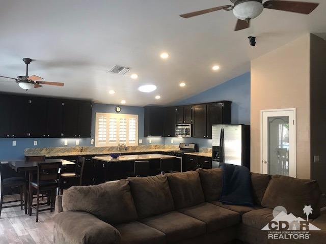 78658 Ewarton Road Bermuda Dunes, CA 92203 - Photo 3 of 10 a living room with furniture and kitchen view