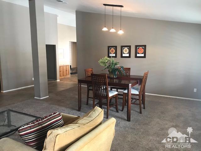 78658 Ewarton Road Bermuda Dunes, CA 92203 - Photo 5 of 10 a dining room with furniture and chandelier