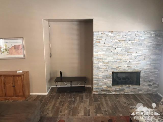 78658 Ewarton Road Bermuda Dunes, CA 92203 - Photo 7 of 10 a living room with furniture and a fireplace