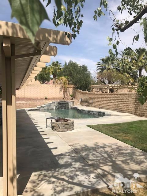 78658 Ewarton Road Bermuda Dunes, CA 92203 - Photo 8 of 10 a view of a swimming pool with an outdoor seating