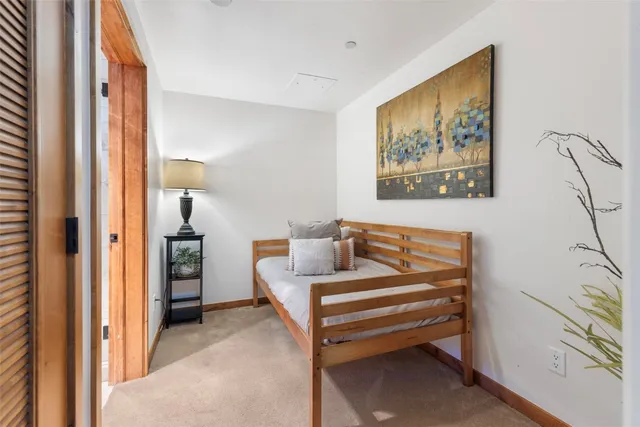 a bedroom with furniture and a gate