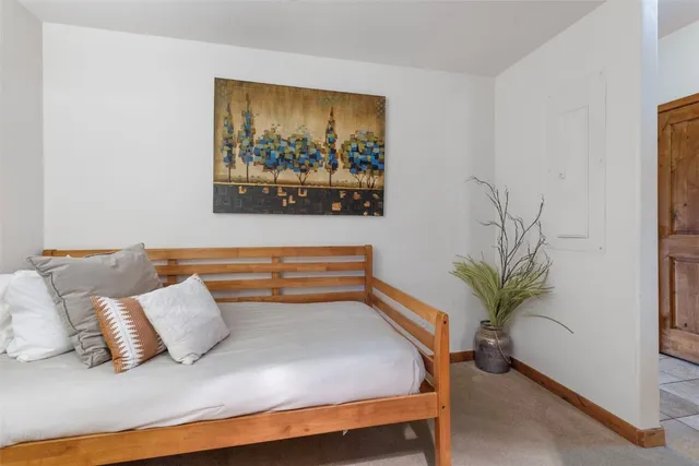 a living room with furniture and potted plant