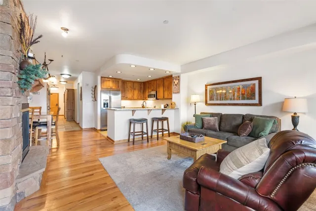 a living room with furniture and a table