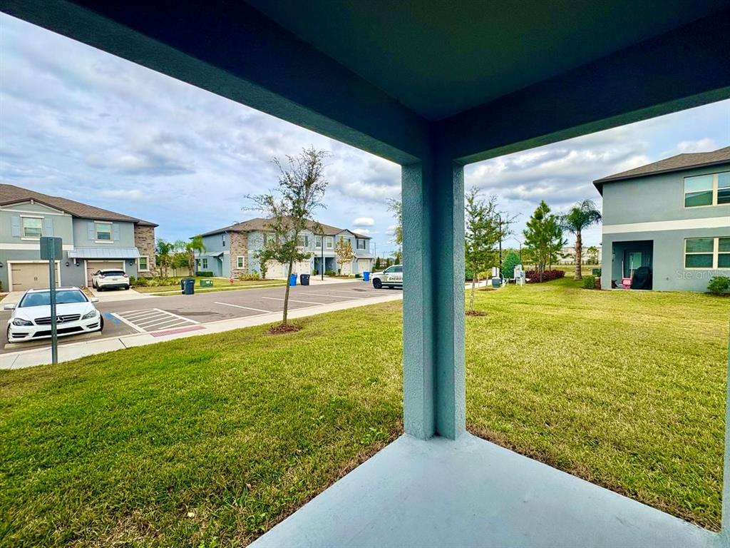 14302 Editors Note Street Ruskin, FL 33573 - Photo 23 of 28 a view of swimming pool with lawn chairs and a yard